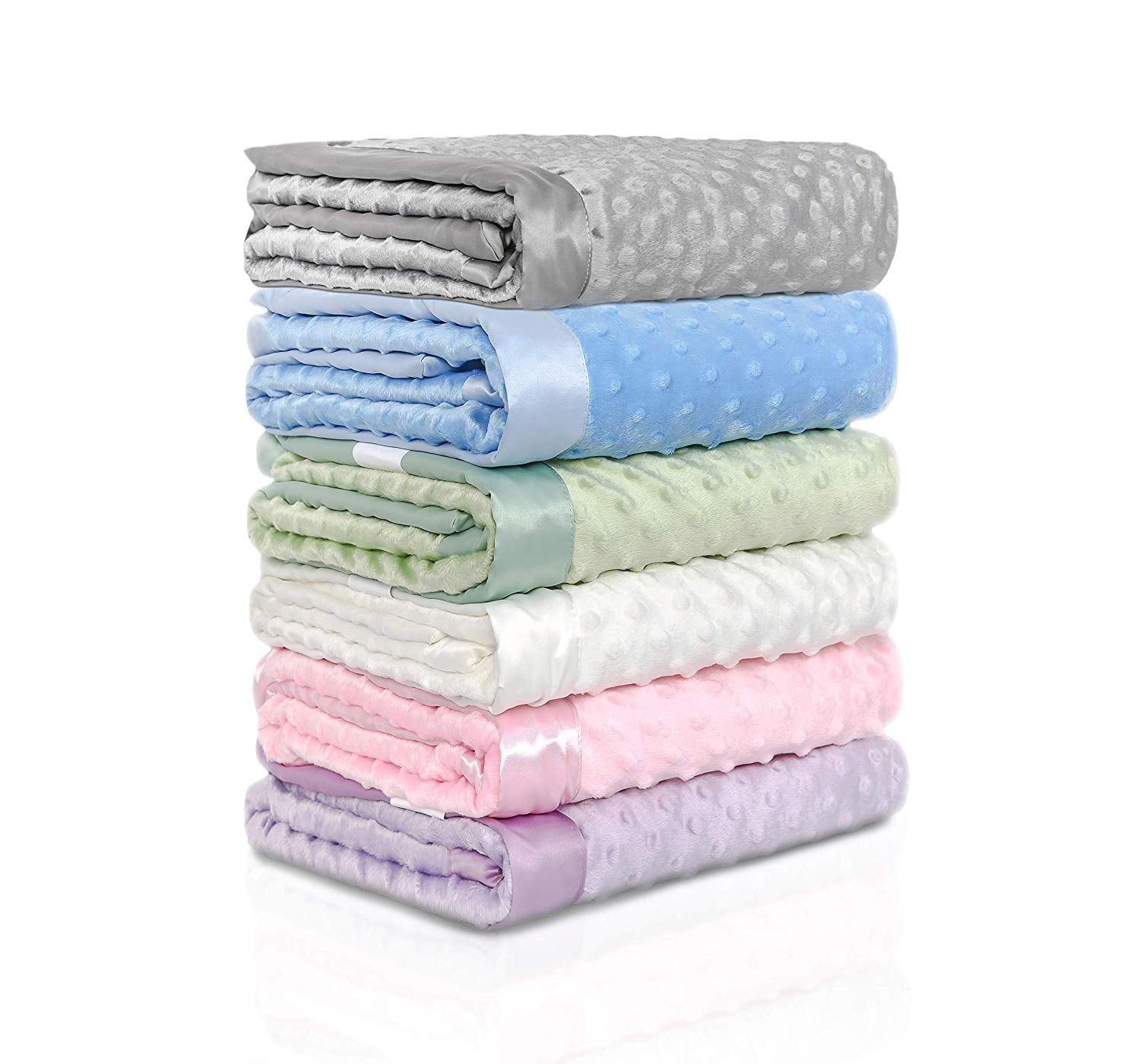 a pile of soft minky baby blankets with dotted backing and silky trim. They are various pastel colors and look really soft!